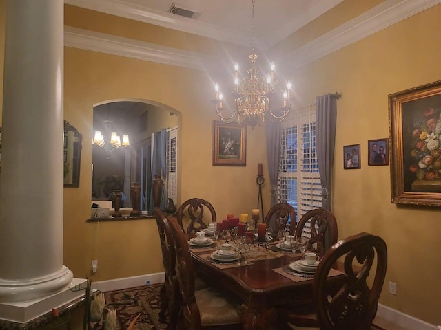 dining room with an inviting chandelier, ornate columns, and crown molding