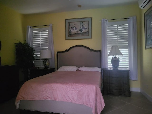 tiled bedroom with a wall unit AC