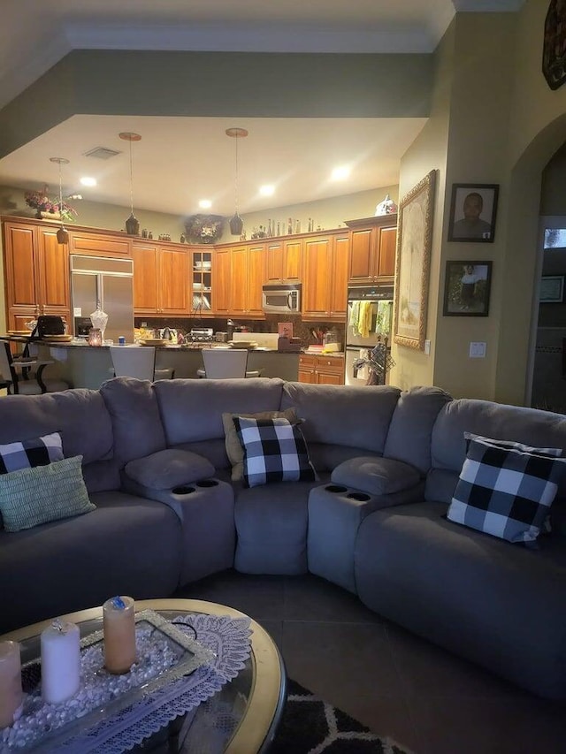 living room with dark tile patterned flooring