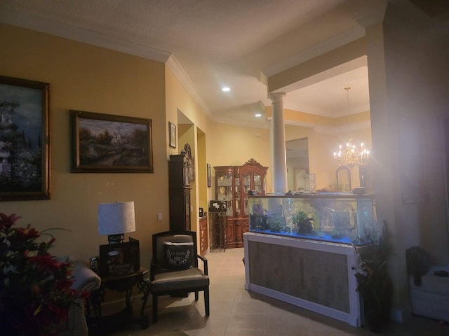 interior space featuring a notable chandelier, light tile patterned flooring, ornamental molding, and decorative columns