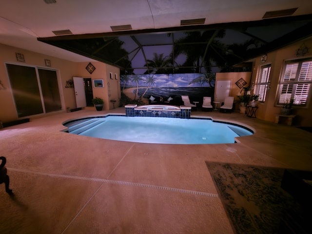 view of pool with an in ground hot tub