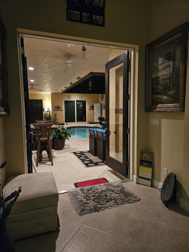 view of pool with ceiling fan