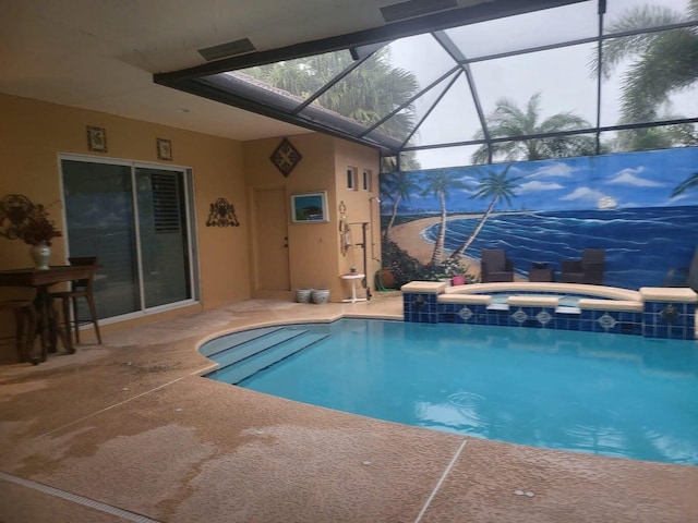 view of swimming pool with a patio area, a lanai, and an in ground hot tub