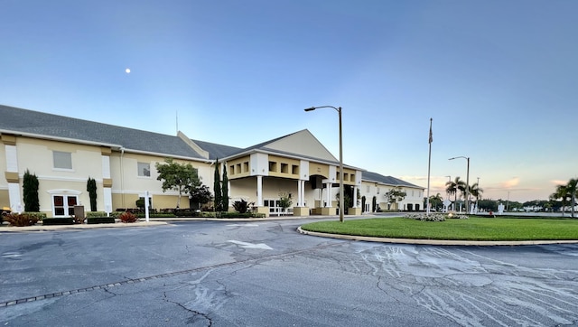 view of outdoor building at dusk