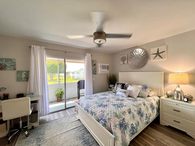 bedroom featuring access to outside, a wall mounted AC, dark wood-type flooring, and ceiling fan