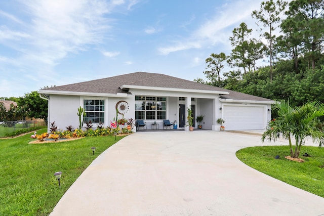 view of front of property with a garage and a front yard