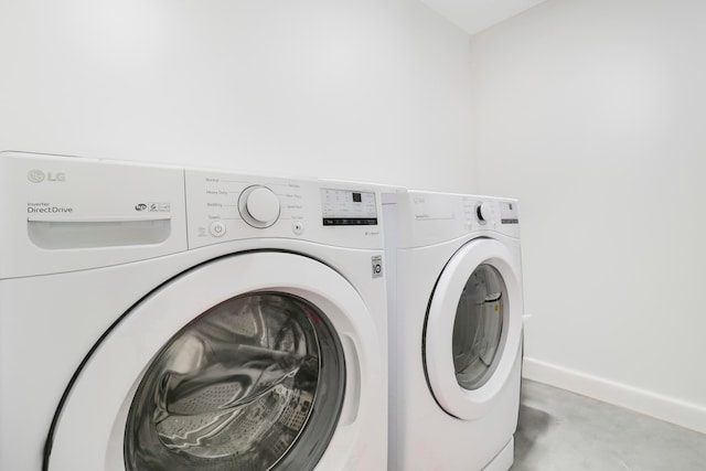 laundry room with washer and dryer