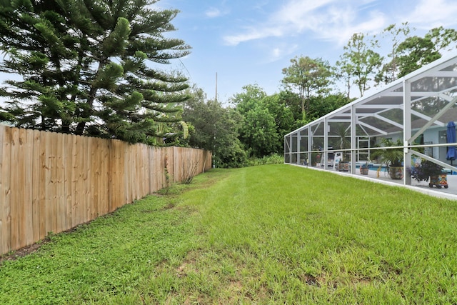 view of yard featuring a lanai