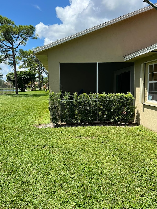 view of property exterior featuring a lawn