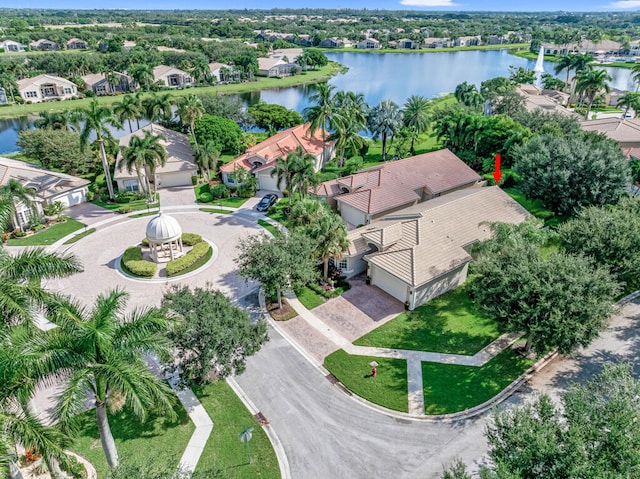 birds eye view of property with a water view