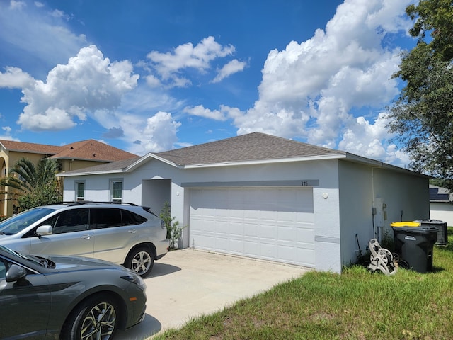 ranch-style house featuring a garage