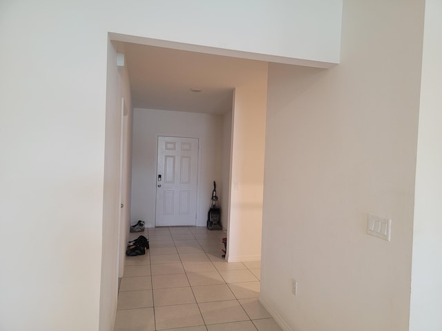 hallway with light tile patterned flooring