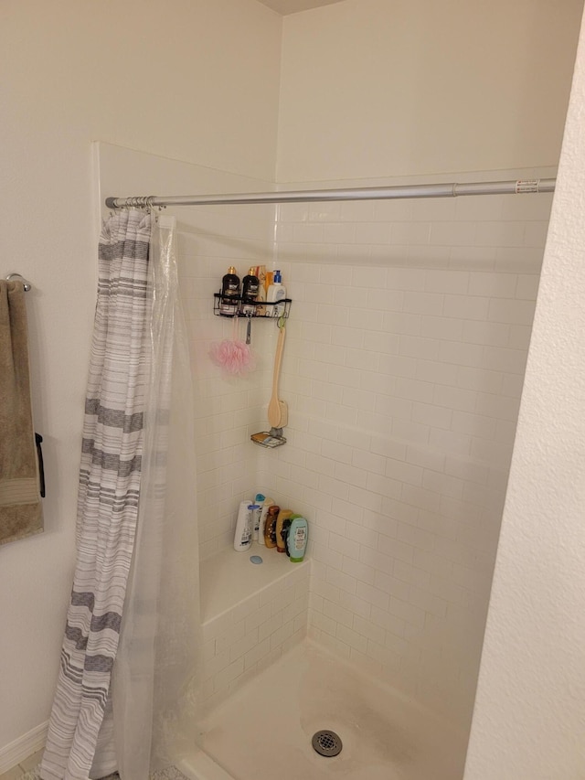 bathroom featuring walk in shower