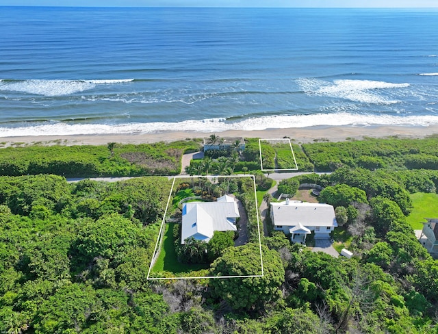 aerial view with a water view and a view of the beach