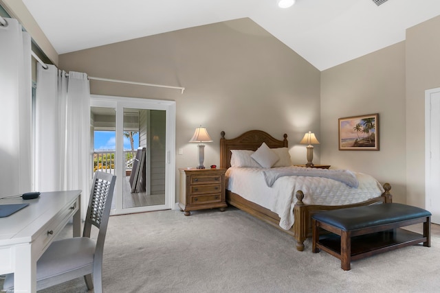 carpeted bedroom with high vaulted ceiling and access to exterior