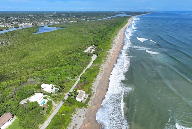 bird's eye view with a water view and a view of the beach