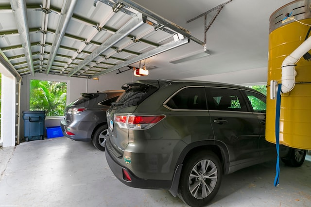 garage with a garage door opener and a carport