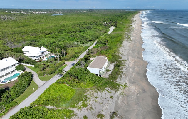 bird's eye view with a water view and a view of the beach