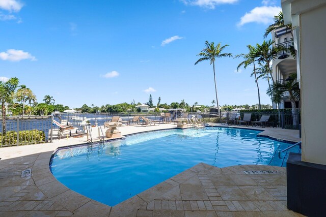 view of swimming pool with a patio area