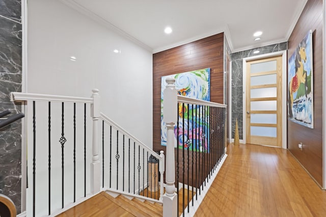 entrance foyer with ornamental molding, wood finished floors, and recessed lighting