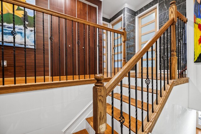 stairway with crown molding