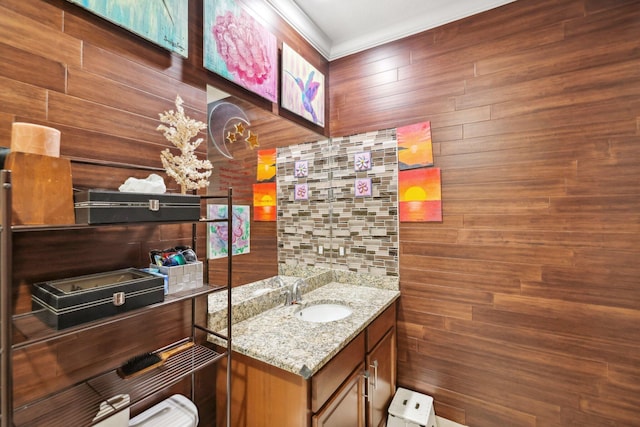 bathroom with wood walls and vanity