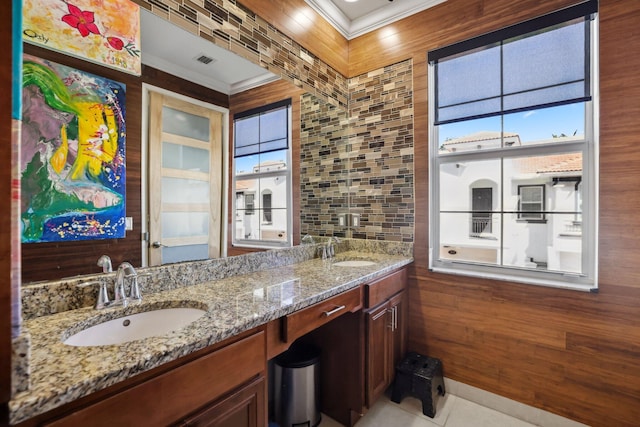 full bath featuring crown molding, double vanity, and tile patterned floors