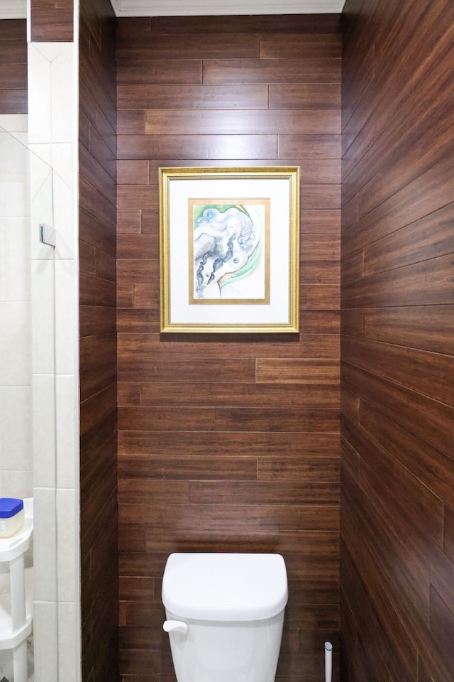 bathroom featuring toilet and a relaxing sauna