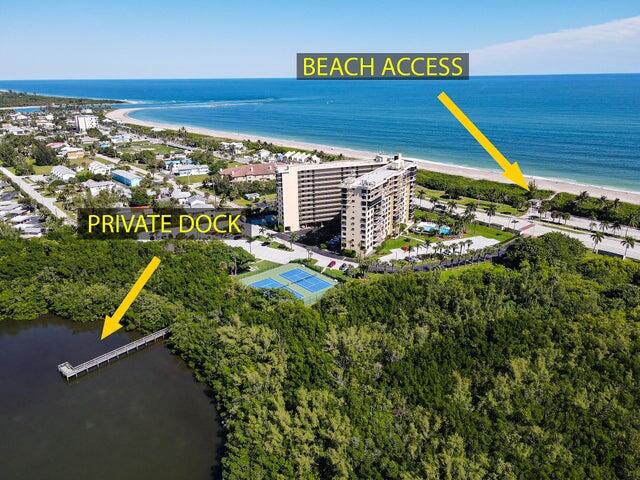 birds eye view of property featuring a view of the beach and a water view