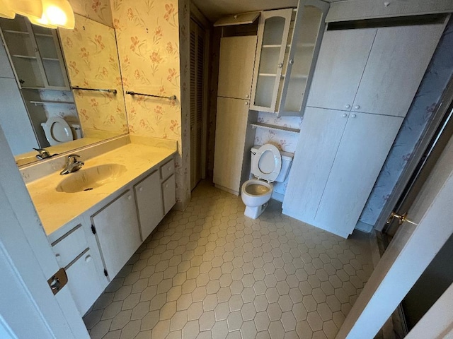 bathroom with tile patterned floors, toilet, and vanity