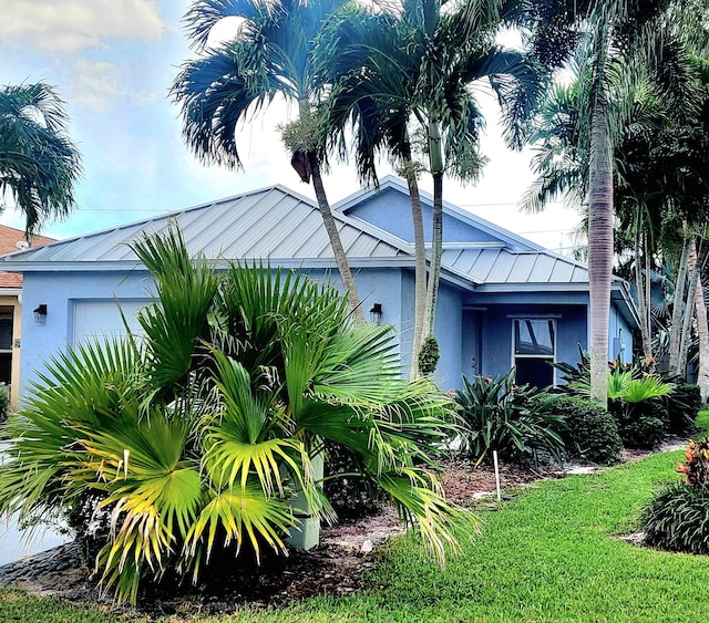 view of home's exterior featuring a lawn