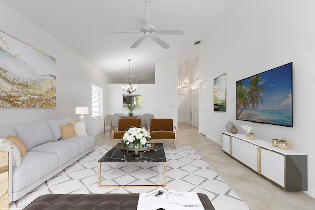 living room featuring lofted ceiling and ceiling fan with notable chandelier