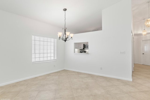 unfurnished room featuring a notable chandelier and light tile patterned floors