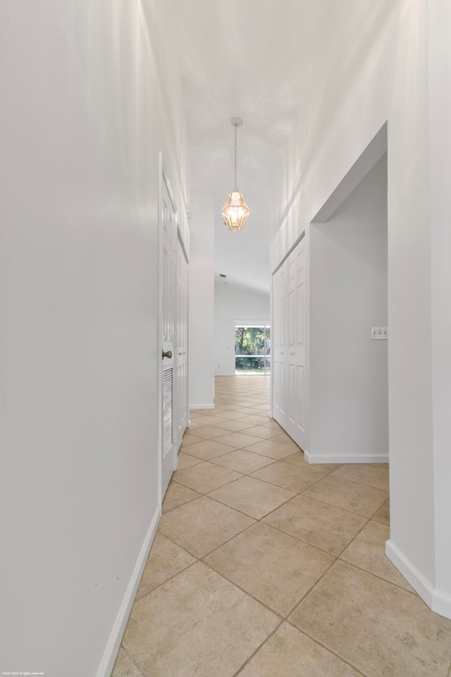 corridor with light tile patterned floors