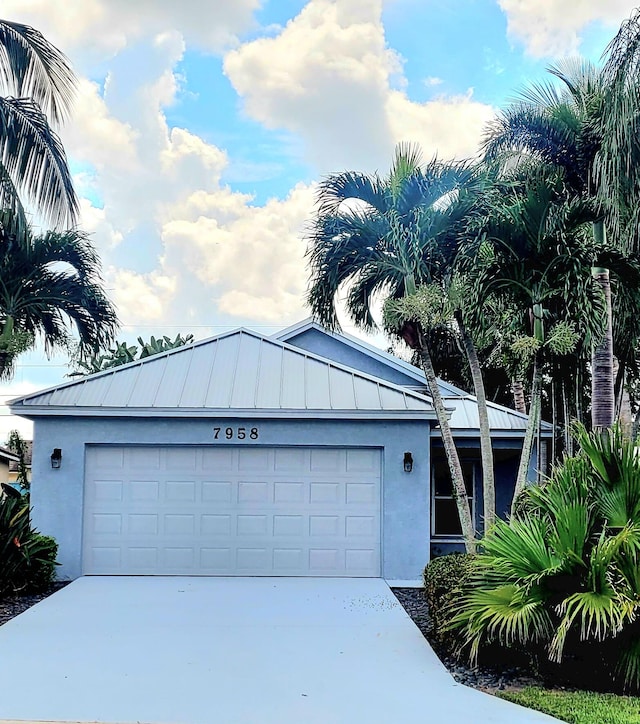 view of front of property with a garage