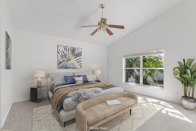 bedroom with ceiling fan, light carpet, and high vaulted ceiling