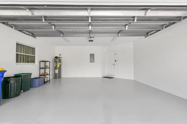 garage featuring water heater and electric panel