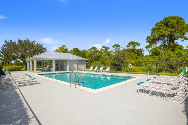 view of swimming pool featuring a patio