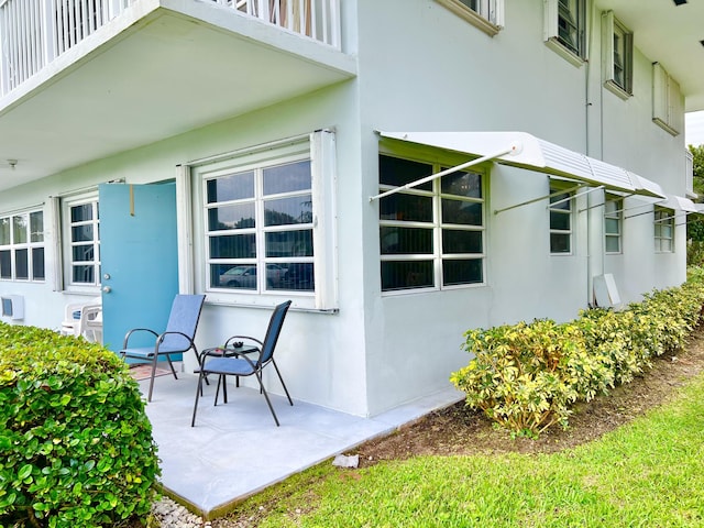 exterior space with a patio and stucco siding