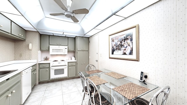 kitchen featuring white appliances, ceiling fan, and light tile patterned floors