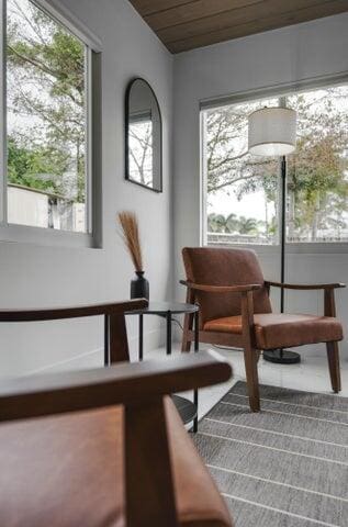 living area featuring wood ceiling