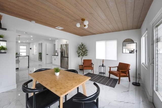 dining room with wood ceiling