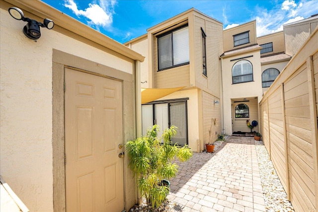 doorway to property featuring a patio