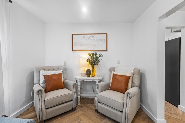 living area with parquet floors