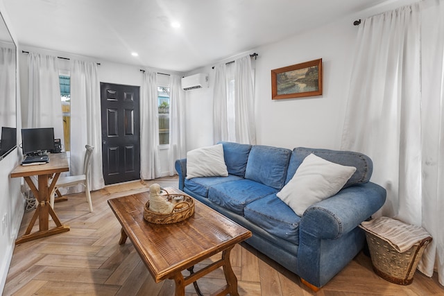 living room featuring light parquet flooring and an AC wall unit