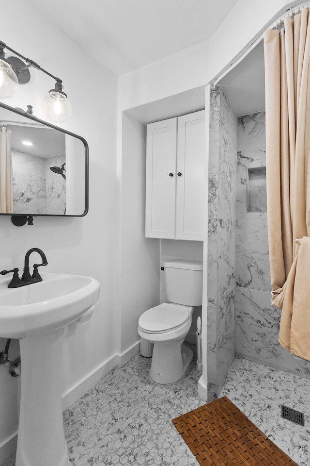 bathroom with toilet, walk in shower, and tile patterned floors