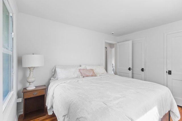 bedroom with hardwood / wood-style flooring