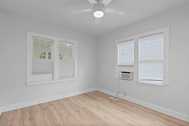 spare room with light hardwood / wood-style flooring, ceiling fan, and a healthy amount of sunlight