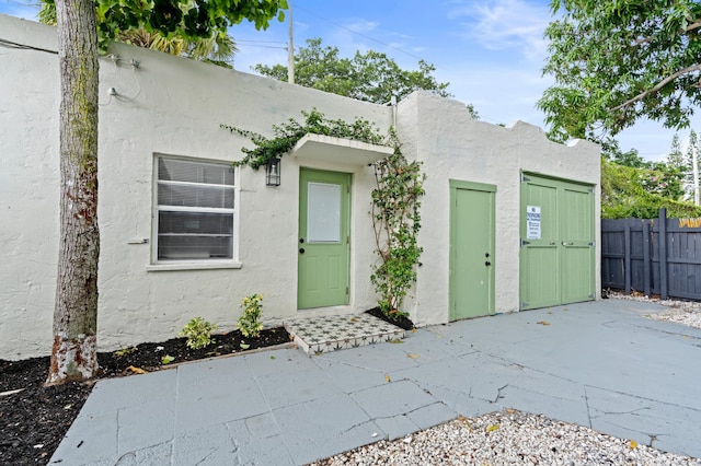 entrance to property with a patio area