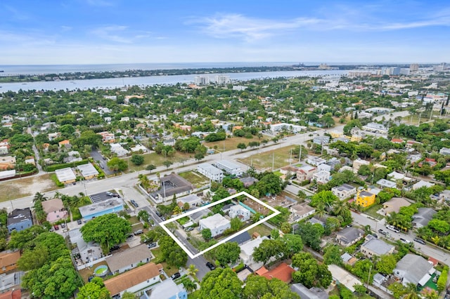 birds eye view of property with a water view